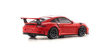 Kyosho Mini-Z MR-04 RWD Porsche 911 GT3 Lava Orange RC car on a track, showcasing detailed design and vibrant orange color.