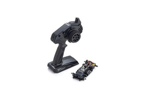 Kyosho Mini-Z RWD MR-04 RC car chassis and transmitter set, featuring remote control and detailed chassis components.
