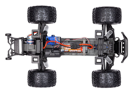 Overhead view of Traxxas Stampede 2WD HD radio-controlled truck chassis showing suspension and drivetrain components.