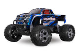 Traxxas Stampede 2WD BL-2s RC truck with blue body, front view showing rugged tires and detailed chassis.