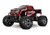 Red Traxxas Stampede 2WD BL-2s remote control monster truck front view, showcasing its rugged tires and detailed body design.