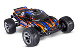 Traxxas Rustler 2WD BL-2s HD remote control car with orange body, three-quarter front view, rugged off-road design.