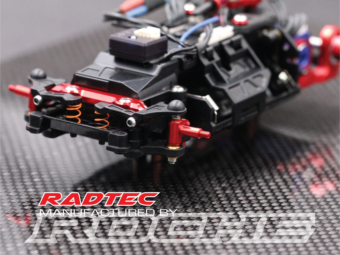 Radtec RC Mini-Z MR04 aluminum steering knuckle set showing precision-machined metal parts on a white background.