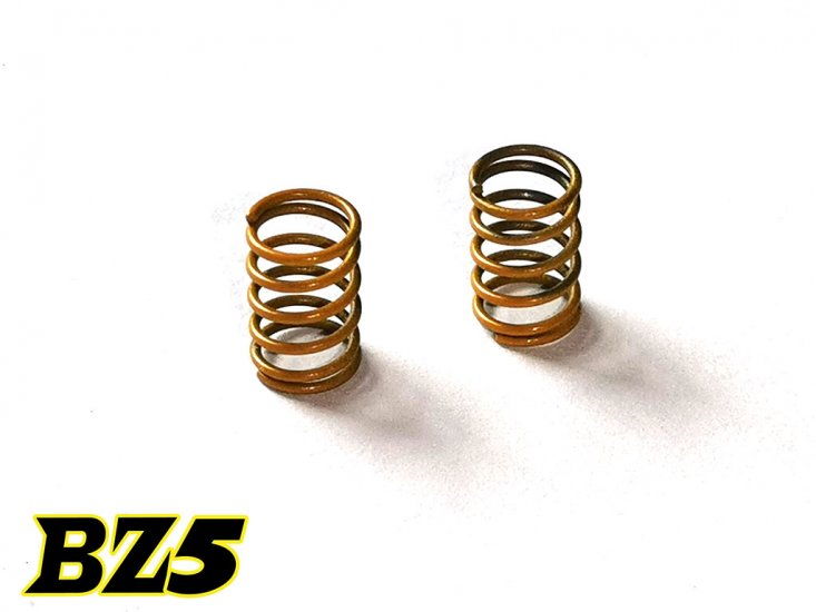 Atomic RC BZ5 rear springs for RC cars, showing close-up of silver coil springs on a black background.