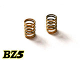 Atomic RC BZ5 rear springs for RC cars, showing close-up of silver coil springs on a black background.