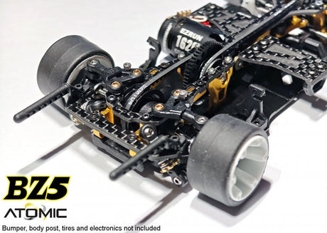 Atomic RC Z5 Belt Drive 4WD RC chassis kit with durable components and sleek design, shown with assembled frame and drivetrain parts.