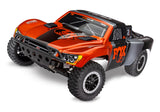 Traxxas Slash 2WD VXL RC truck front three-quarter view showing its sleek body and rugged wheels.