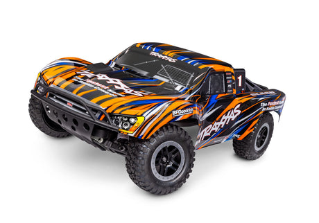 Traxxas Slash 2WD BL-2s remote control truck with orange body, front view showing sporty design and off-road tires.