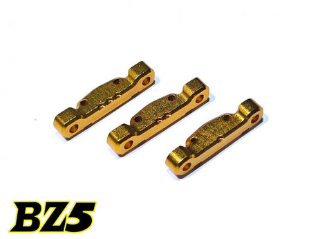 Atomic RC BZ5 aluminum rear arm mounts, set of 3, with black anodized finish for RC car suspension upgrade.