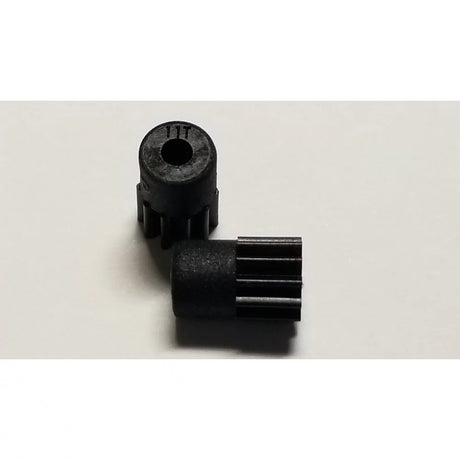Two 11-tooth GL Racing 64P Longlife Pinion Set gears for RC cars, showing detailed metal construction and gear teeth.