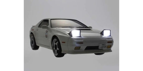 Kyosho First Mini-Z RC Mazda RX-7 FC3S Ryosuke Takahashi car part with detailed design and light accents on a white background.