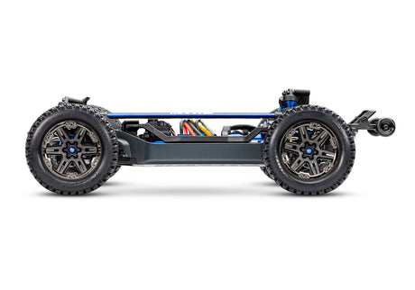 Side view of the Traxxas Rustler 4X4 VXL Ultimate remote control truck showing chassis and detailed off-road design.