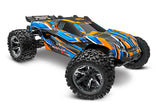 Traxxas Rustler 4X4 VXL remote control monster truck with orange body and detailed front view, showcasing rugged off-road tires.