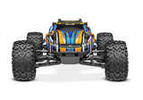Traxxas Rustler 4X4 VXL radio-controlled monster truck with orange body and detailed front view.