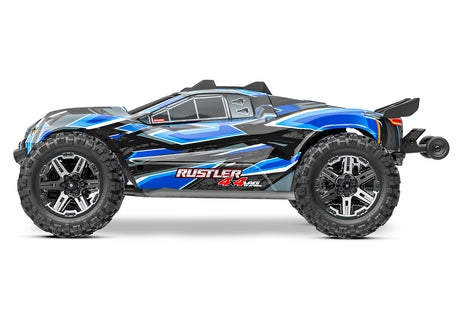 Blue Traxxas Rustler 4X4 VXL remote control truck shown from the side, featuring rugged tires and detailed body design.