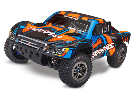 Orange Traxxas Slash 4X4 VXL Ultimate RC truck shown from the front quarter angle, highlighting its rugged design and vibrant color.