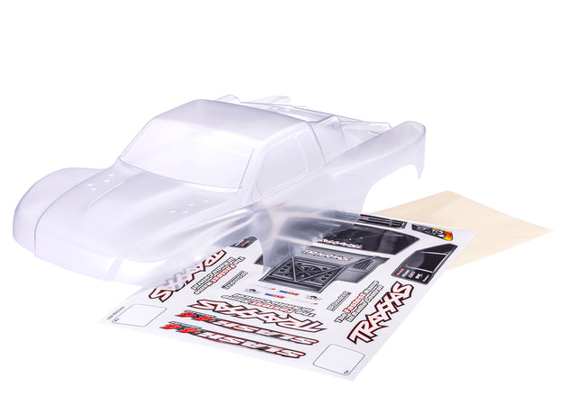 Traxxas Slash 4X4 clear clipless RC truck body with detailed design and open wheel arches for off-road racing.