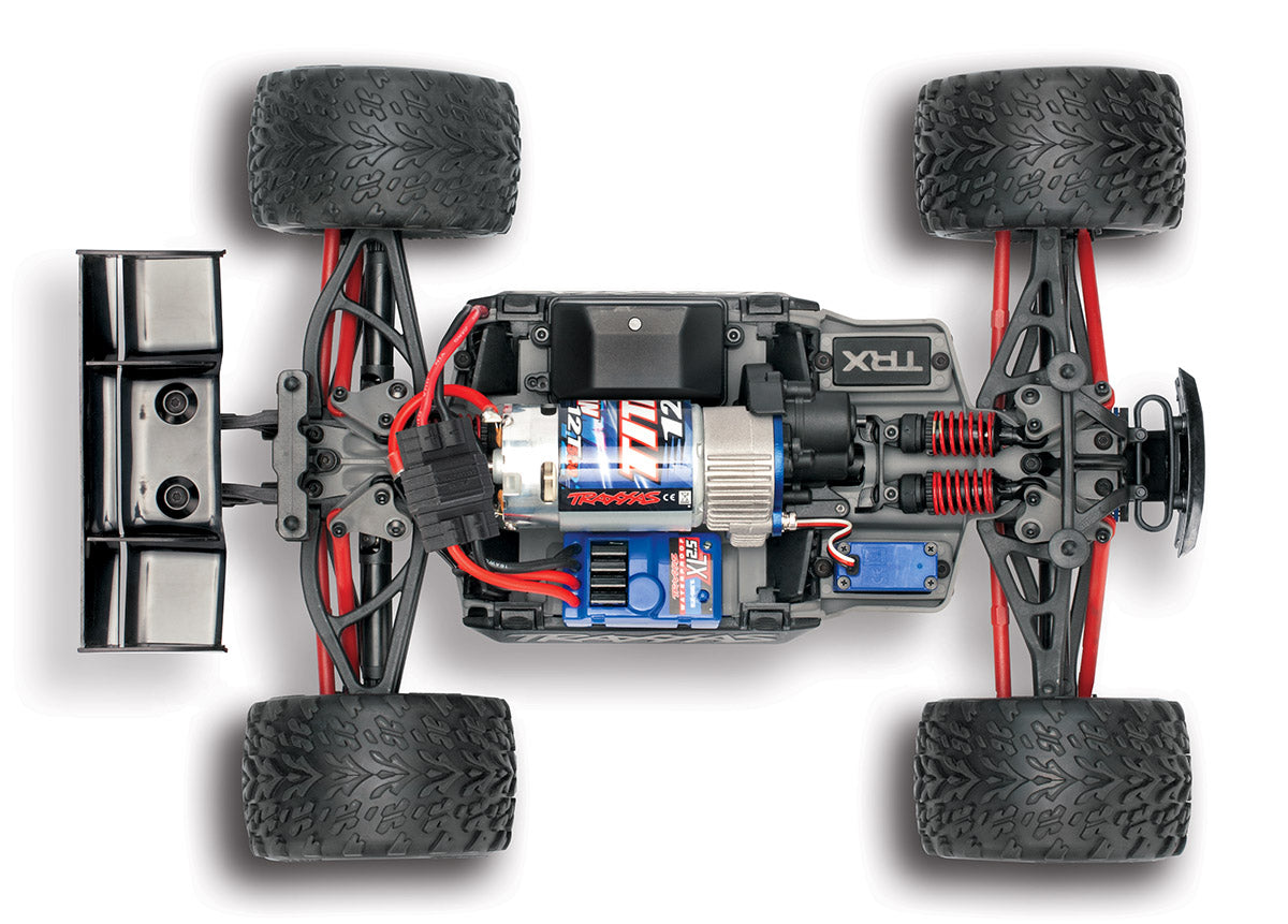 Traxxas 1/16 E-Revo 4X4 RC truck top chassis view, showing detailed suspension and body design for off-road performance.