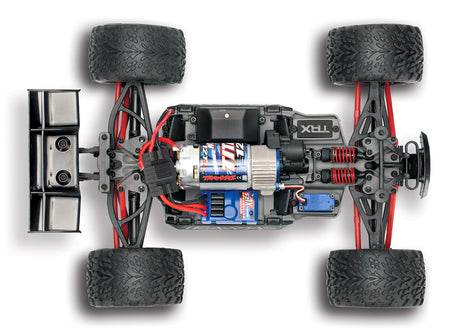 Traxxas 1/16 E-Revo 4X4 RC truck top chassis view, showing detailed suspension and body design for off-road performance.