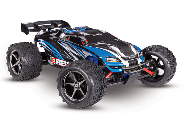 Blue Traxxas 1/16 E-Revo 4X4 RC car shown from a three-quarter low angle, highlighting its detailed design and rugged construction.