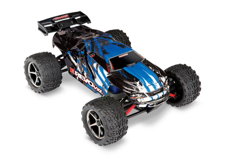 Blue Traxxas 1/16 E-Revo VXL 4X4 remote control monster truck shown from a three-quarter high angle.