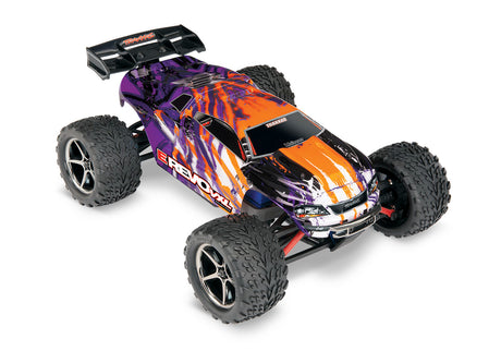 Traxxas 1/16 E-Revo VXL 4x4 RC truck with purple body, three-quarter view showing off detailed design and rugged tires.