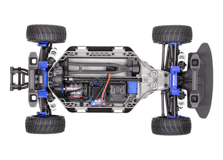 Traxxas Ford Fiesta ST Rally BL-2s remote control car with top chassis view, showcasing detailed rally car design and features