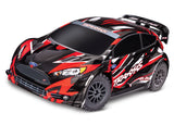 Red Traxxas Ford Fiesta ST Rally BL-2s RC car with detailed exterior and rally car design, ready for off-road racing.