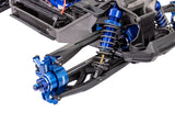 Traxxas X-Maxx Ultimate remote control monster truck front suspension with detailed shock absorbers and durable chassis.