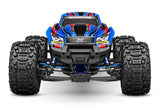 Blue Traxxas X-Maxx Ultimate RC monster truck viewed from the front showing large tires and detailed body design