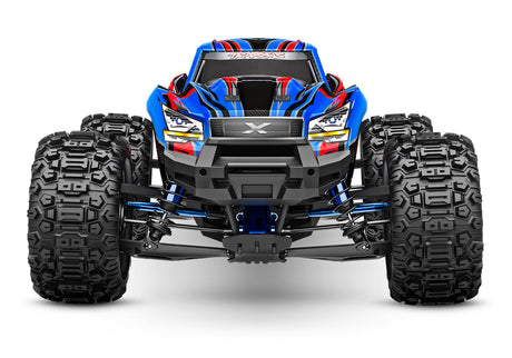 Blue Traxxas X-Maxx Ultimate RC monster truck viewed from the front showing large tires and detailed body design