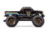 Traxxas X-Monster BIGFOOT 50th anniversary radio-controlled truck, side view showing detailed body and large tires.