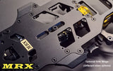Atomic RC MRX 2WD Pan Car Kit shown with assembled chassis and racing wheels on a smooth track surface.