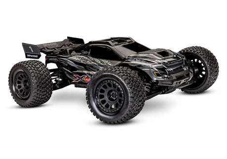 Traxxas XRT 8S RC truck in orange, front three-quarter view showing rugged off-road design and large tires.