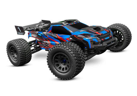 Traxxas XRT Ultimate remote control truck in blue, showing front view with rugged tires and detailed body design.