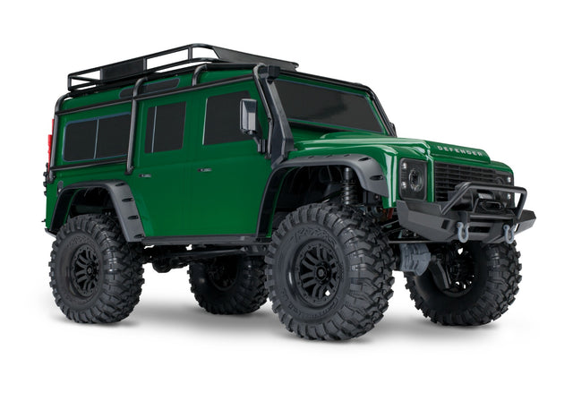 Green Traxxas TRX-4 Land Rover Defender RC truck shown from a three-quarter front angle.