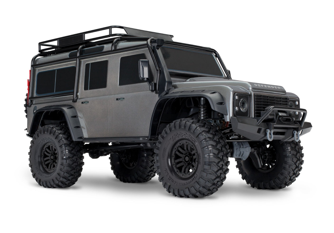 Traxxas TRX-4 Land Rover Defender RC model with silver exterior, front three-quarter view showing detailed rugged design.