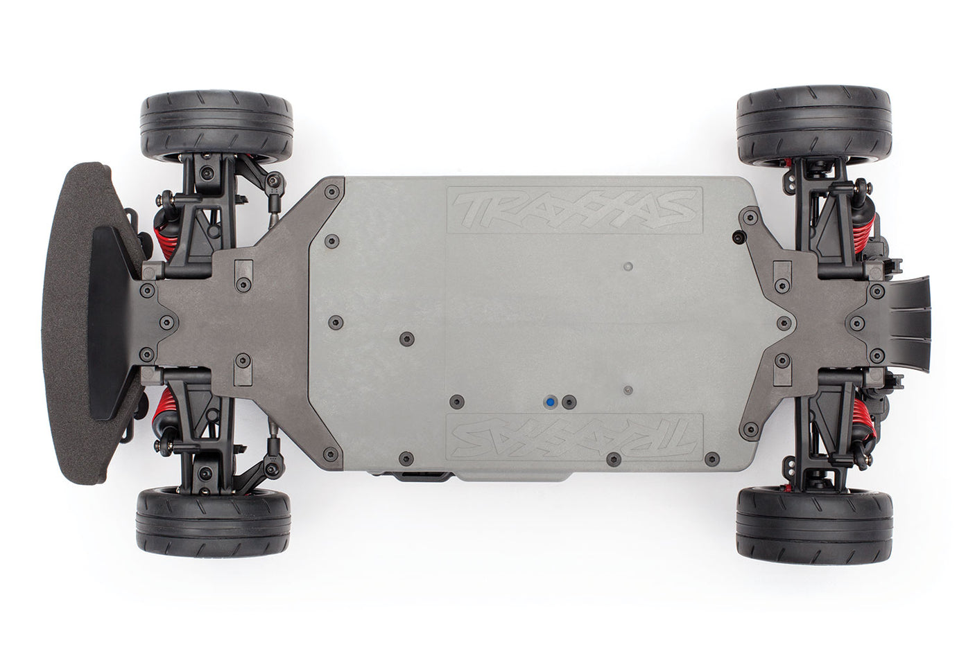 Traxxas 4-Tec 2.0 VXL chassis bottom view, showcasing the durable plastic construction and detailed design elements.