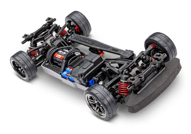 Traxxas 4-Tec 2.0 BL-2s chassis shown from a three-quarter front angle, featuring detailed construction and components.