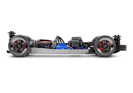 Side view of the Traxxas 4-Tec 2.0 BL-2s RC car chassis, showcasing its sleek black construction and detailed design.