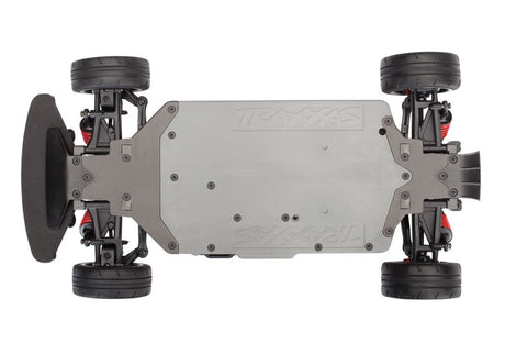 Traxxas 4-Tec 2.0 BL-2s chassis bottom view showing the lightweight, detailed plastic construction with mounting points.