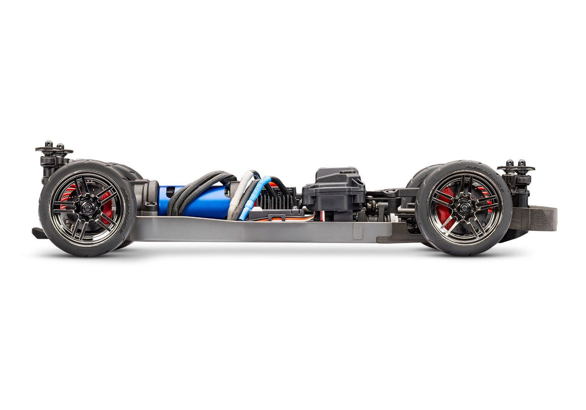 Traxxas 4-Tec 2.0 brushless chassis shown from the side, featuring the sleek design and construction of the RC car chassis.