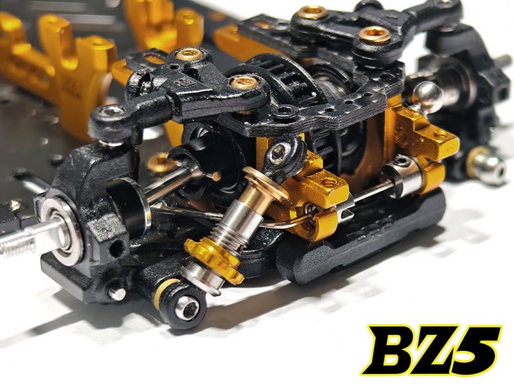 Pair of Atomic RC BZ5 Long Rear Metal Damper shocks for remote control cars, showing the silver metal construction and mounting hardware.