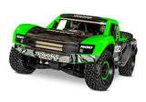 Traxxas Unlimited Desert Racer RC truck with green body, front view showing rugged tires and detailed chassis.