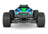 Green Traxxas Maxx RC truck with WideMaxx suspension, front view showing large tires and detailed chassis.
