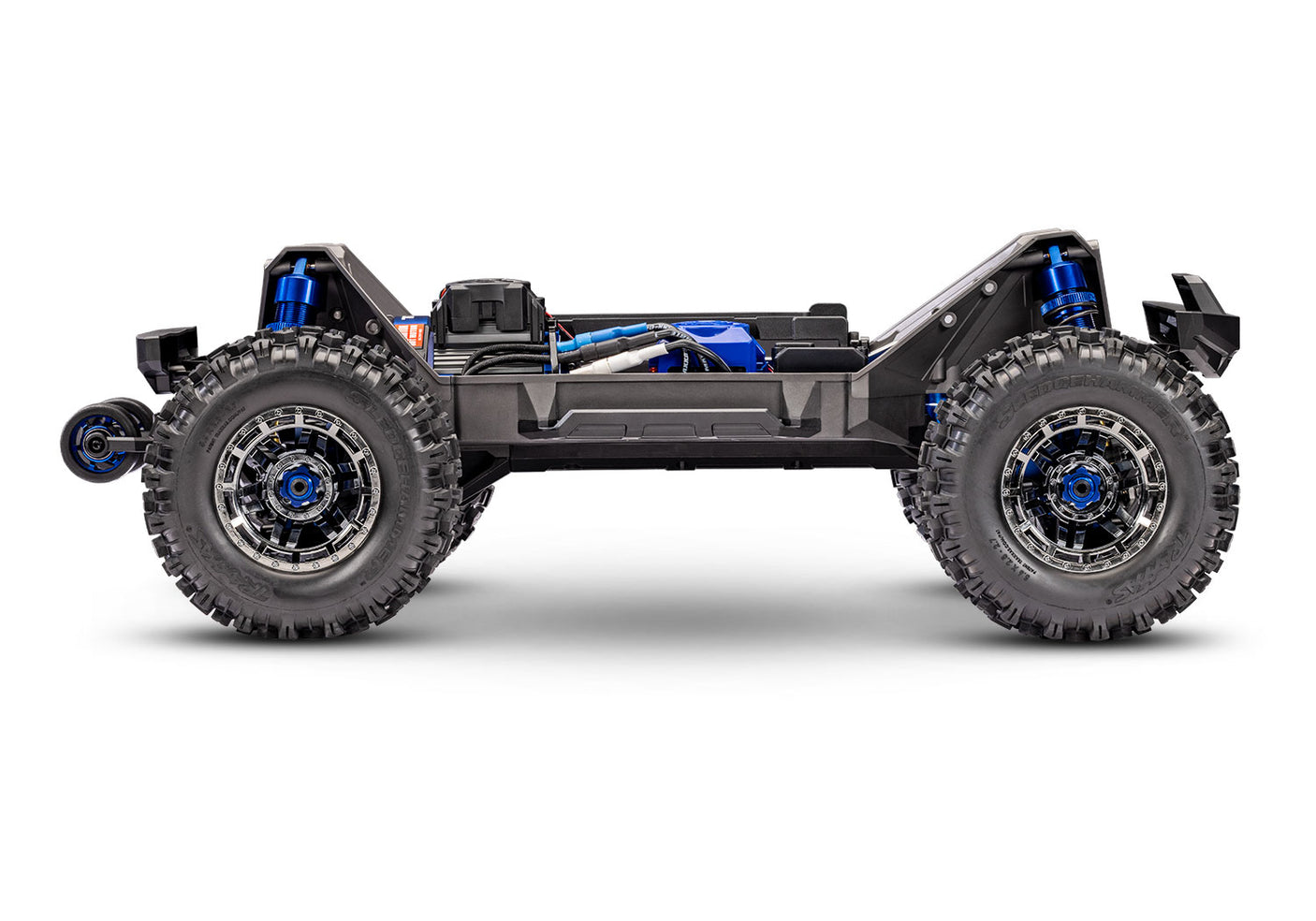 Blue Traxxas Maxx Ultimate RC truck side chassis view showing detailed construction and design from left to right.