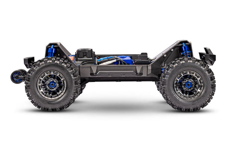 Blue Traxxas Maxx Ultimate RC truck side chassis view showing detailed construction and design from left to right.