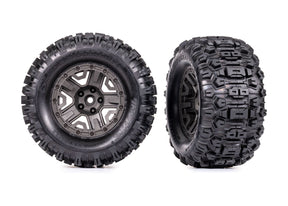 Traxxas 2.8-inch gray wheels with Sledgehammer tires for RC trucks, showing the wheel and tire details on a neutral background.