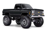 Traxxas TRX-4 Chevrolet K10 High Trail Edition RC truck with black front grille and detailed exterior, showcasing off-road design.