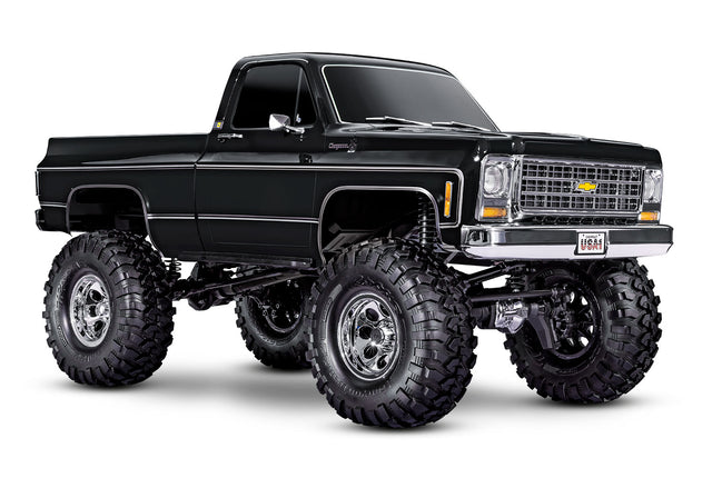 Traxxas TRX-4 Chevrolet K10 High Trail Edition RC truck with black front grille and detailed exterior, showcasing off-road design.